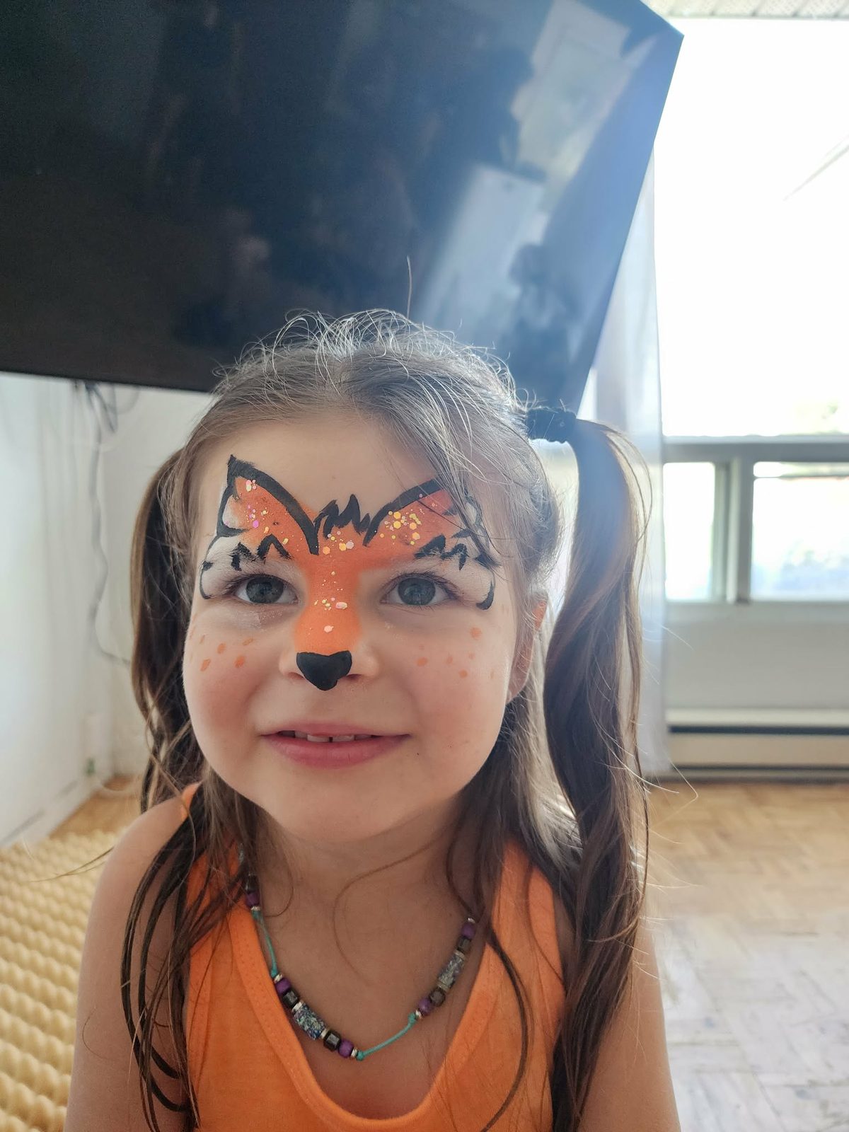 Maquillage de renard orange pour une petite fille